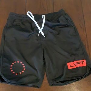 - BLACK LVFT WORKOUT SHORTS WITH RED ACCENTS